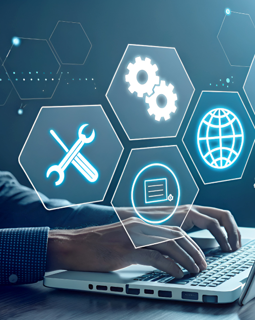 Technology professional working on a laptop with digital service icons